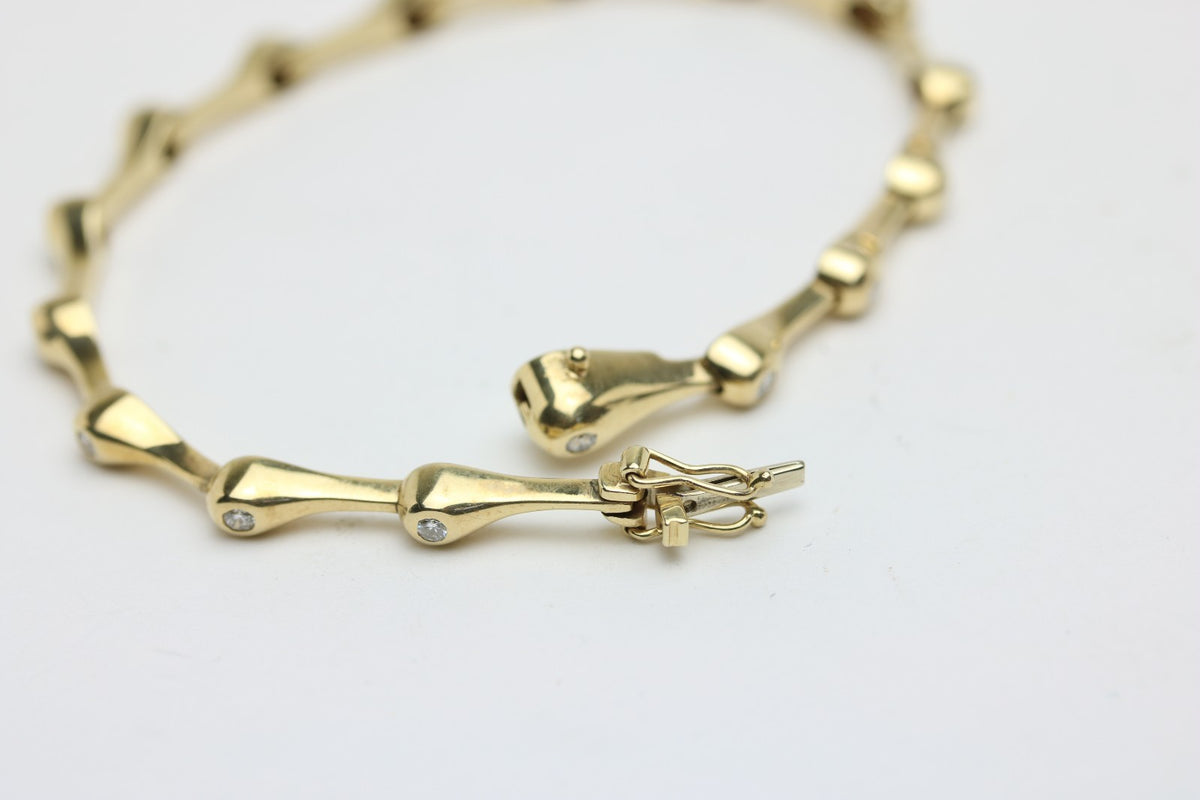Elegantes Tropf Armband für Damen aus 585 Gelbgold mit 15 Diamanten 0.40ct 19cm